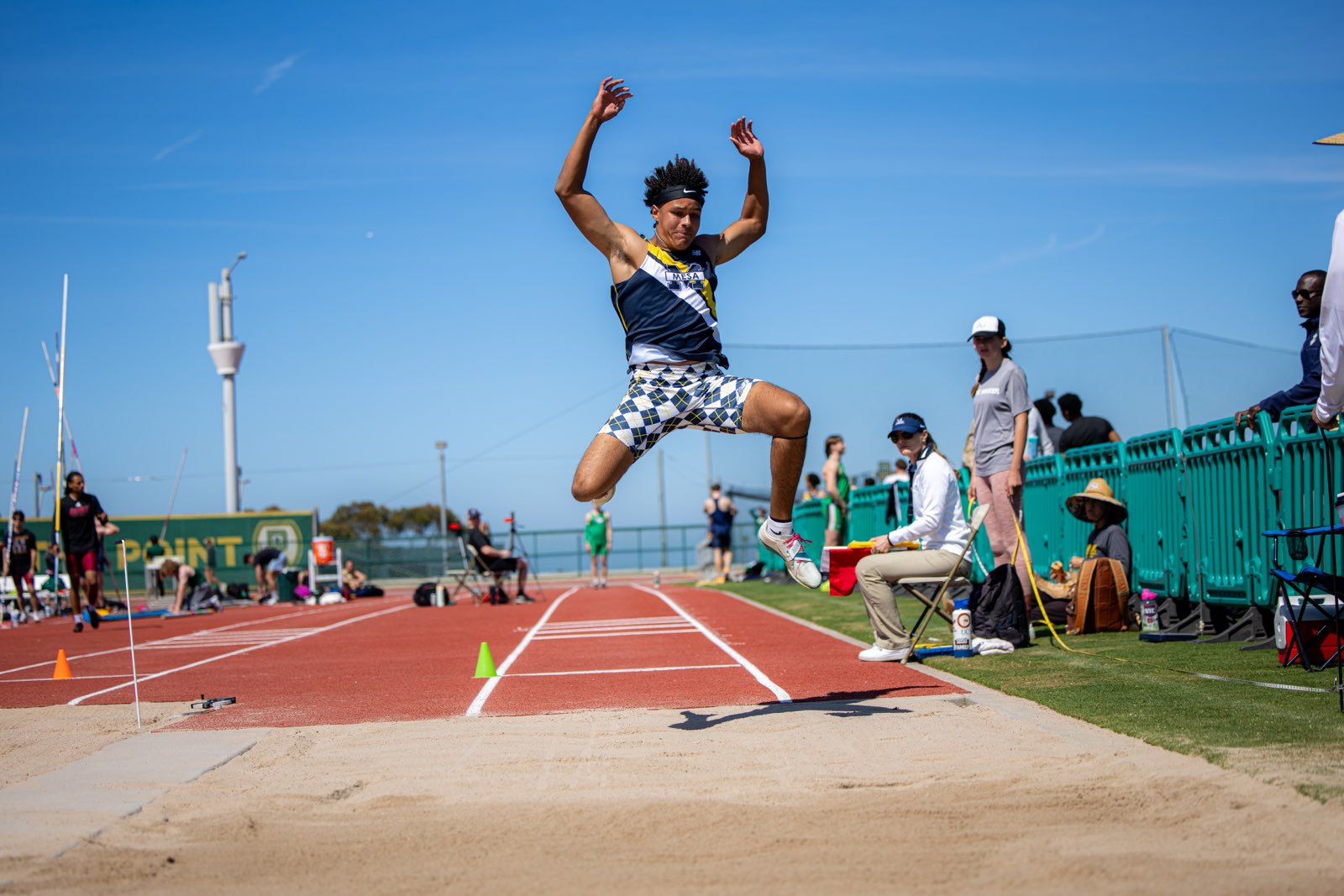 Juleus Lewis jumps 7.21m (23'7.75"), a State A mark and the best jump in the state this season.